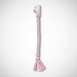 Baby Pink and white braided tug dog toy  on a light white background